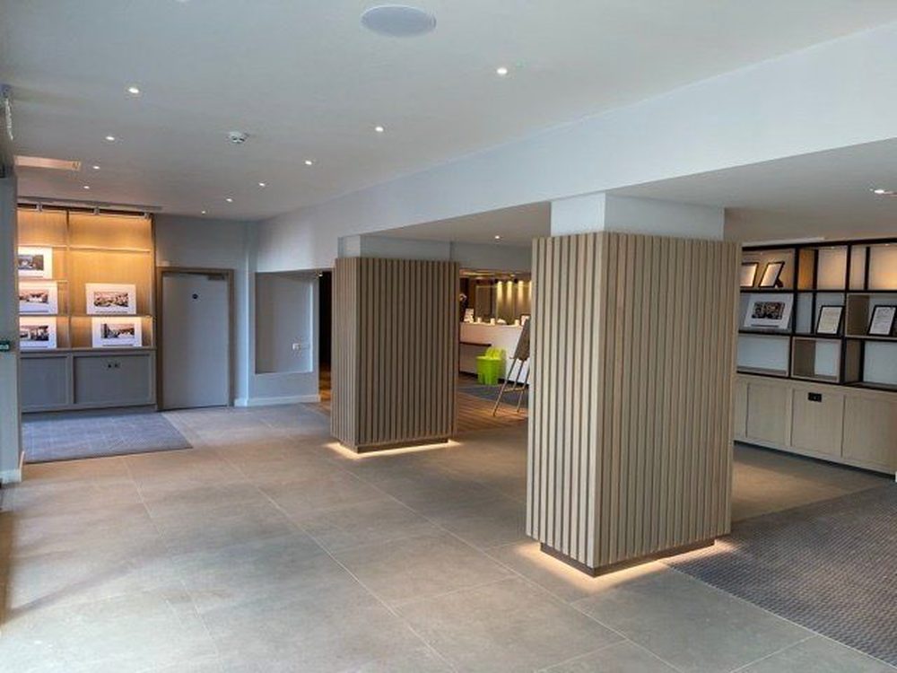 Office reception with linings and feature walls by RWS Interiors