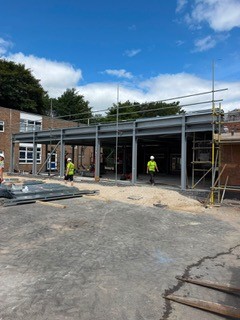 Steel frame extension under construction