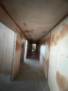 Corridor skim plastered and drying
